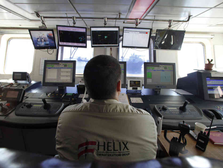 Employee Daniel Loebel sits in the bridge of the the Helix Q4000, as it performs the static kill ope Employee Daniel Loebel sits in the bridge of the the Helix Q4000, as it performs the static kill ope